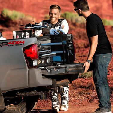 Two Dudes hanging out with their truck tailgate open